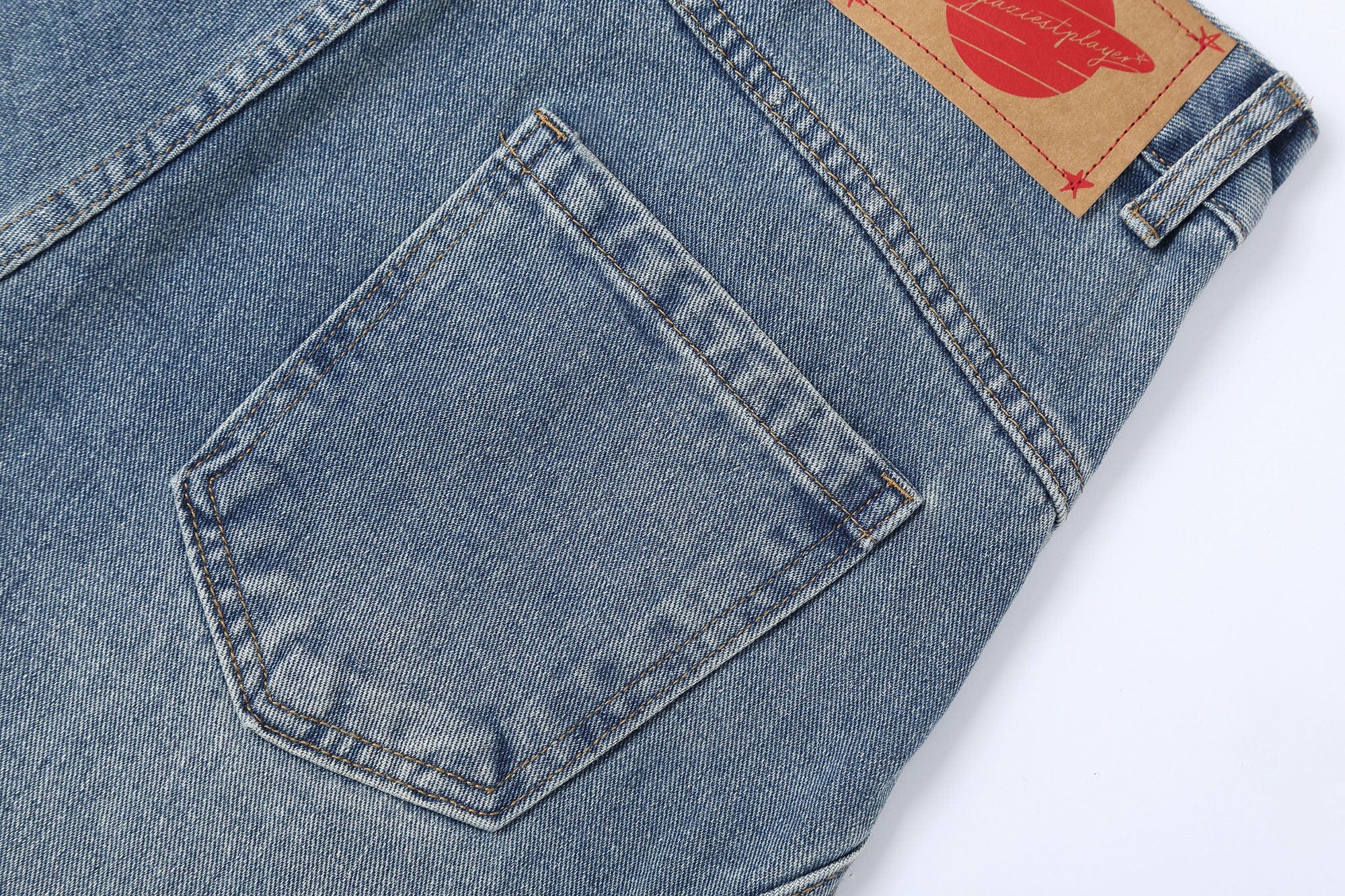 CLP Inverted-Waist Hem Paneled Distressed Jeans