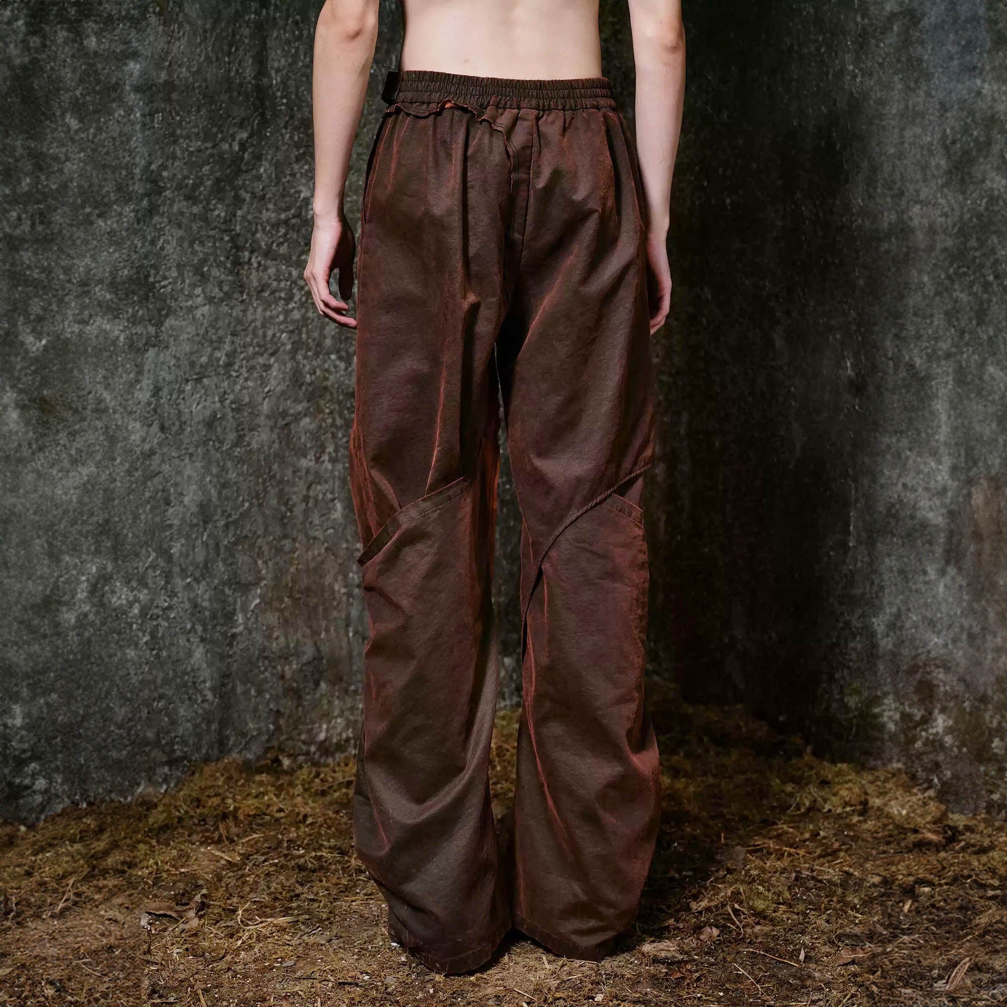 ILNya Nieternite Nifutur Weathered Coated Deconstructed Trousers