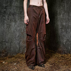 ILNya Nieternite Nifutur Weathered Coated Deconstructed Trousers