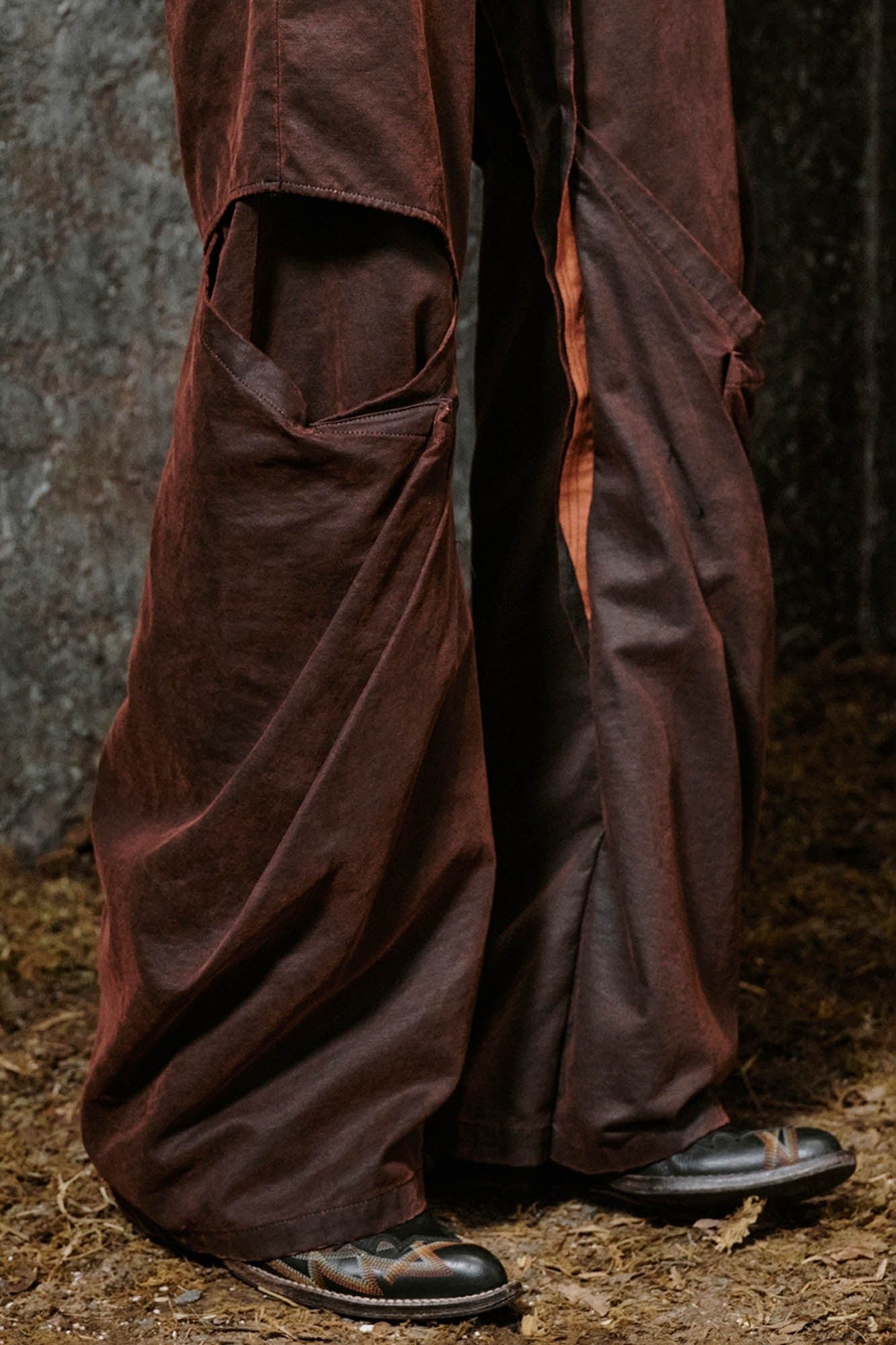 ILNya Nieternite Nifutur Weathered Coated Deconstructed Trousers