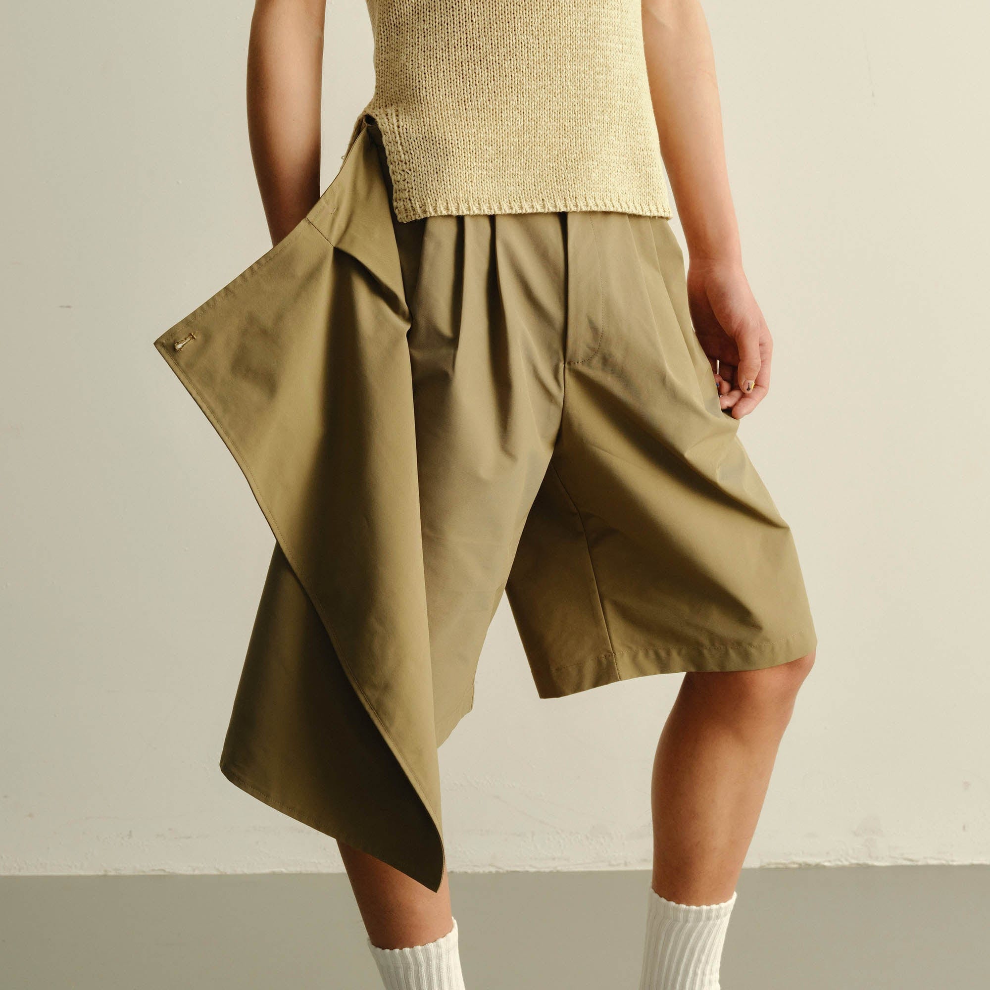 KADAKADA Asymmetrical Overlay Pleated Shorts