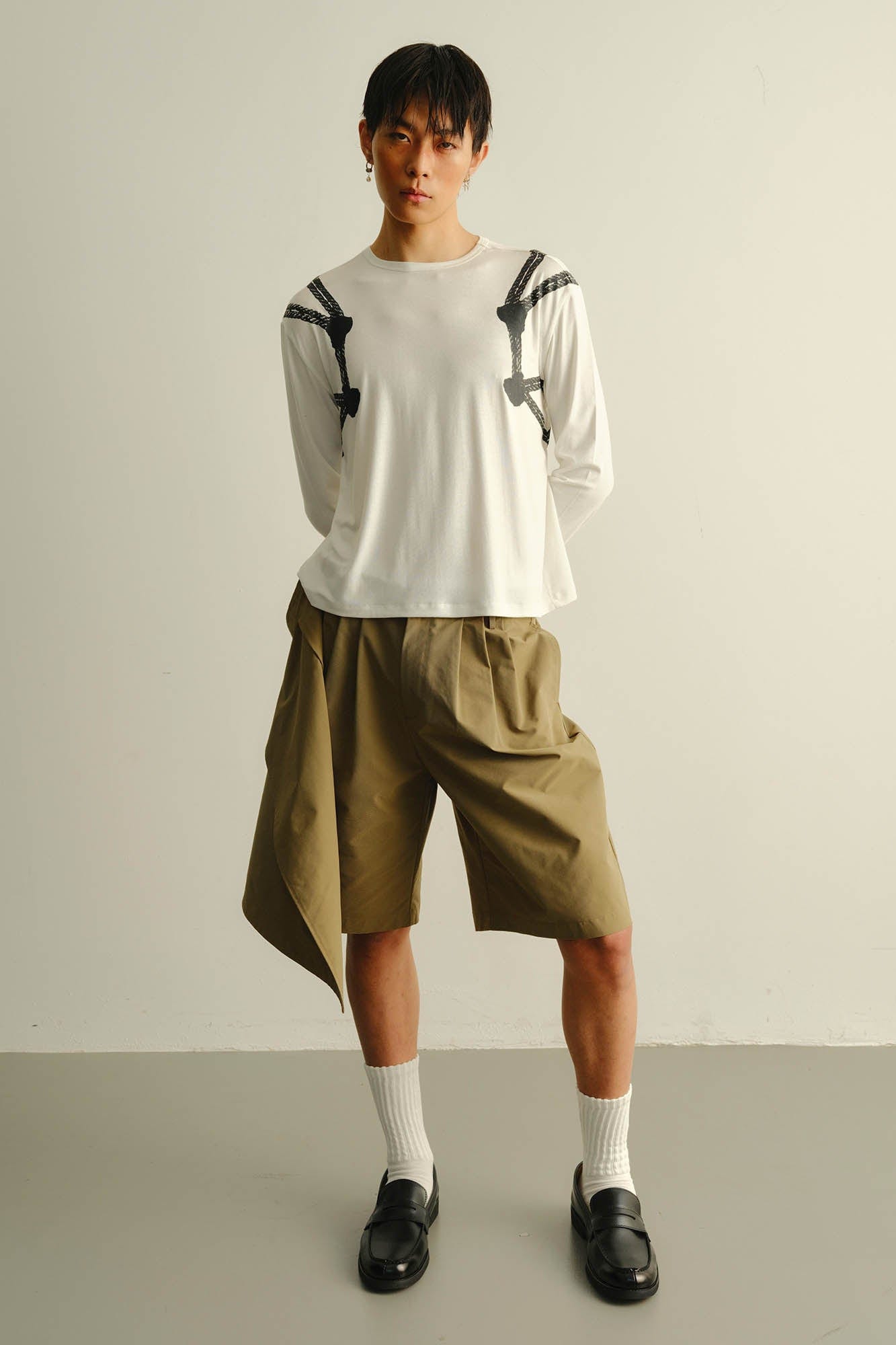 KADAKADA Asymmetrical Overlay Pleated Shorts