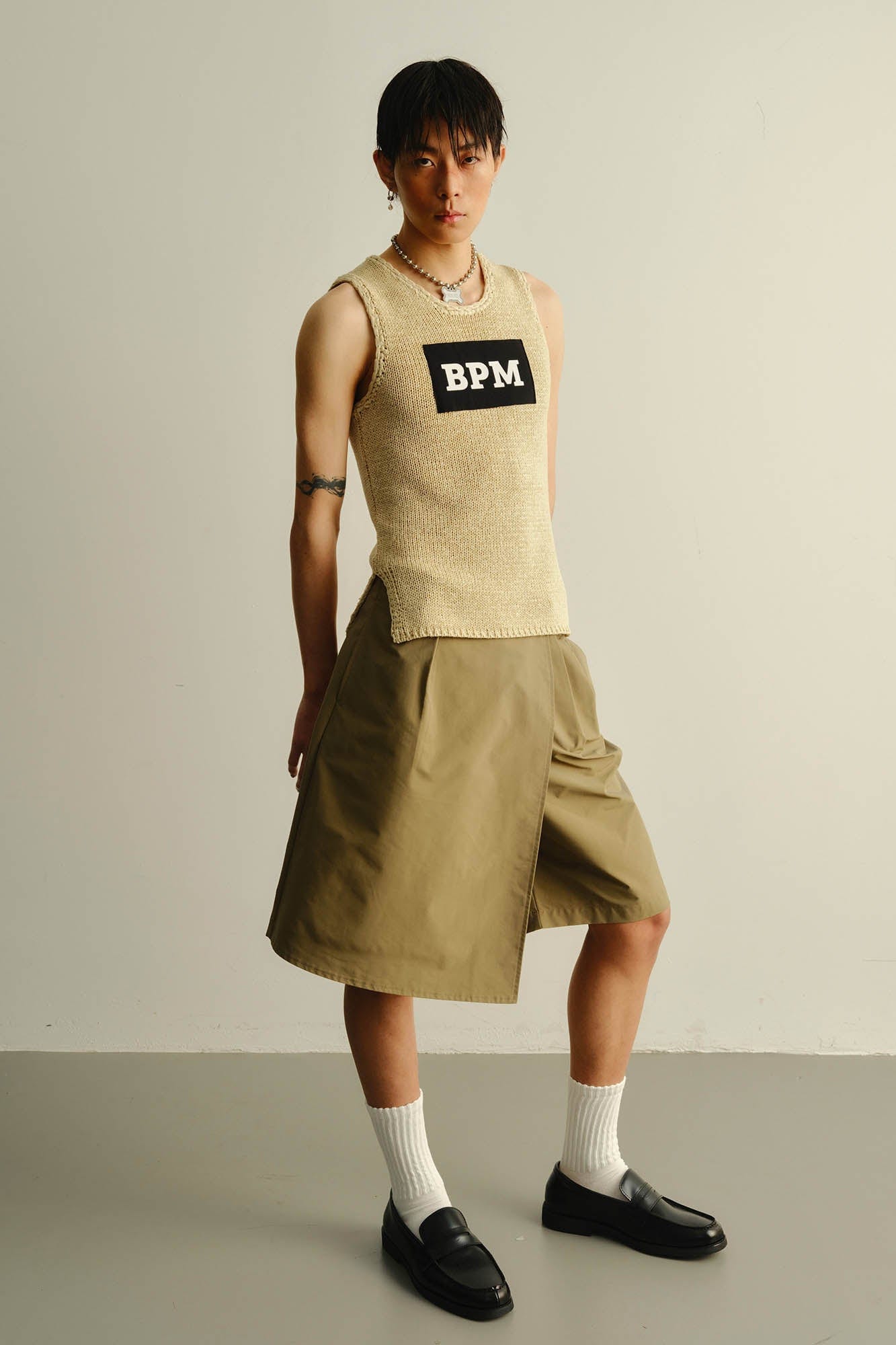 KADAKADA Asymmetrical Overlay Pleated Shorts