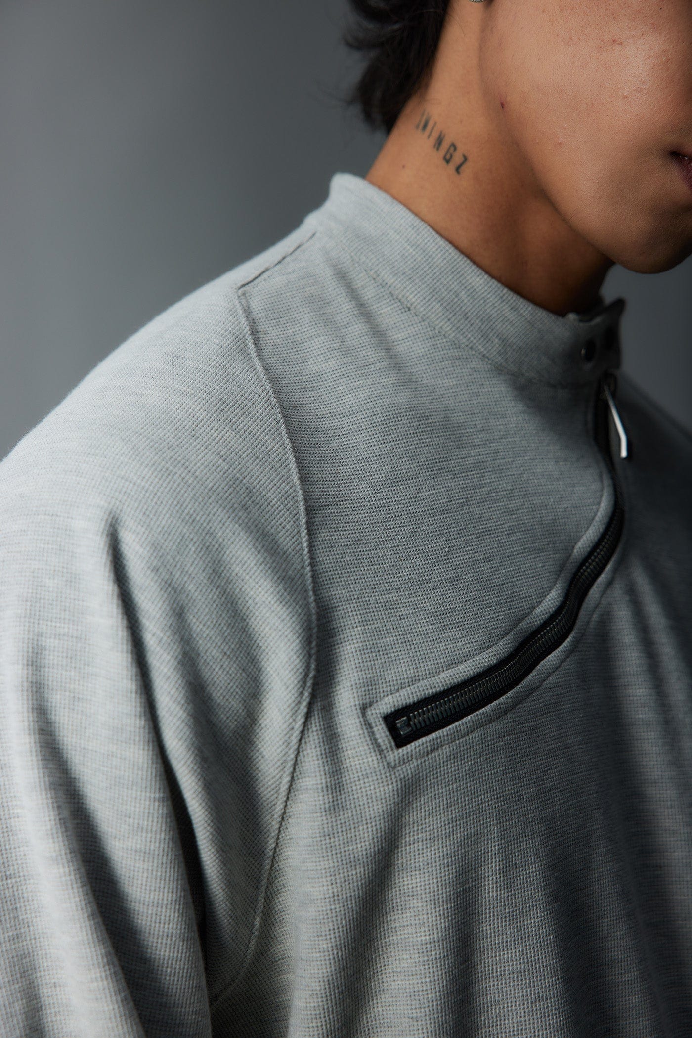 WHISTLEHUNTER Asymmetrical Zipper Rivet Mock Neck Light Sweatshirt