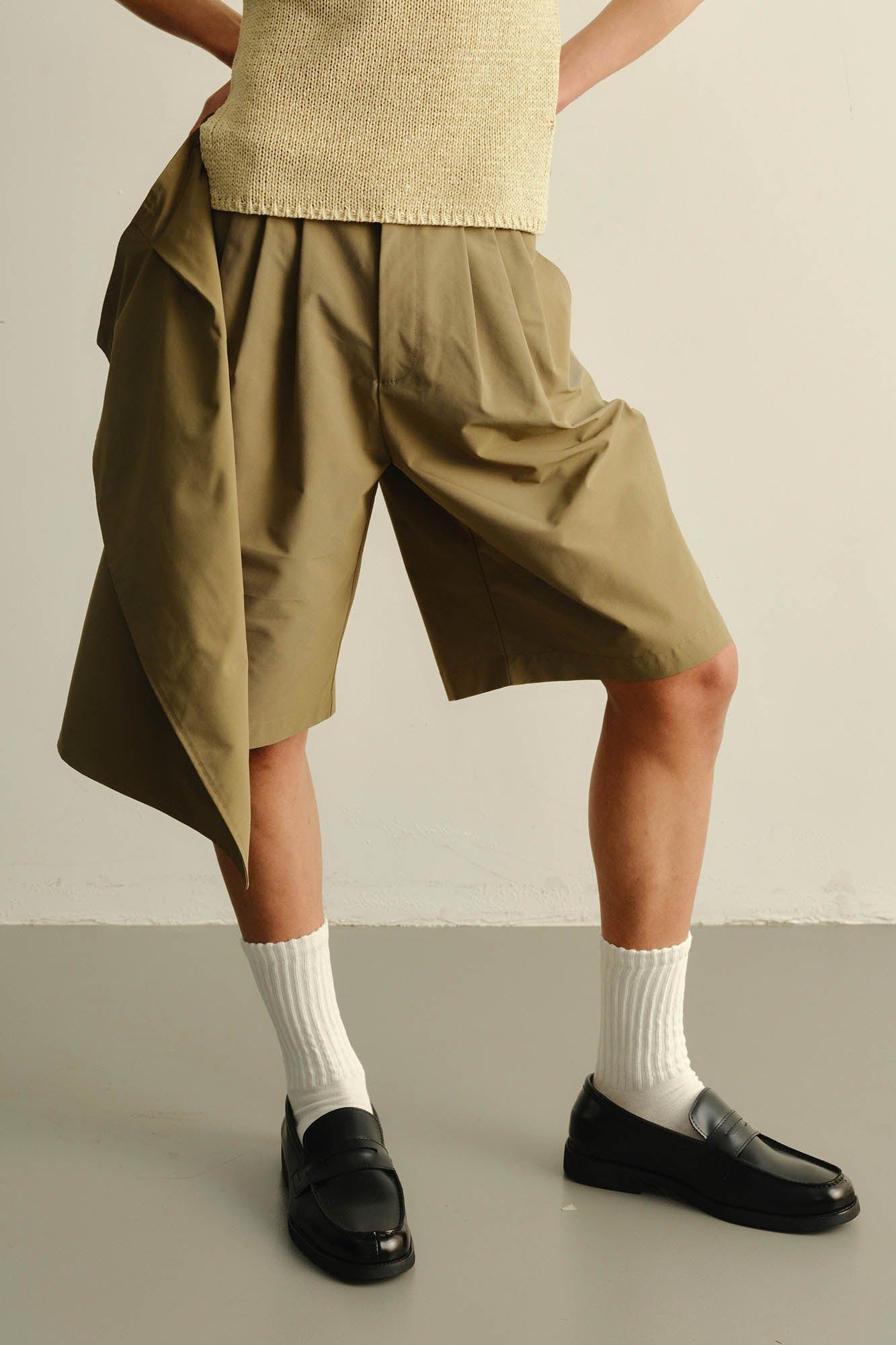 KADAKADA Asymmetrical Overlay Pleated Shorts