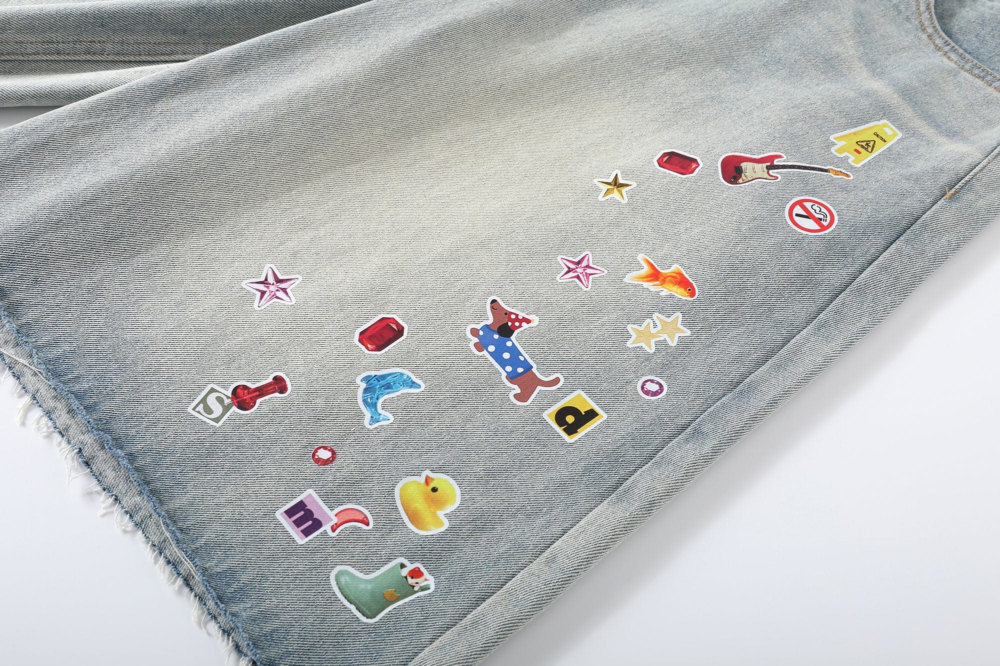 DONSMOKE Whimsical Stickers Washed Raw-Edge Shorts