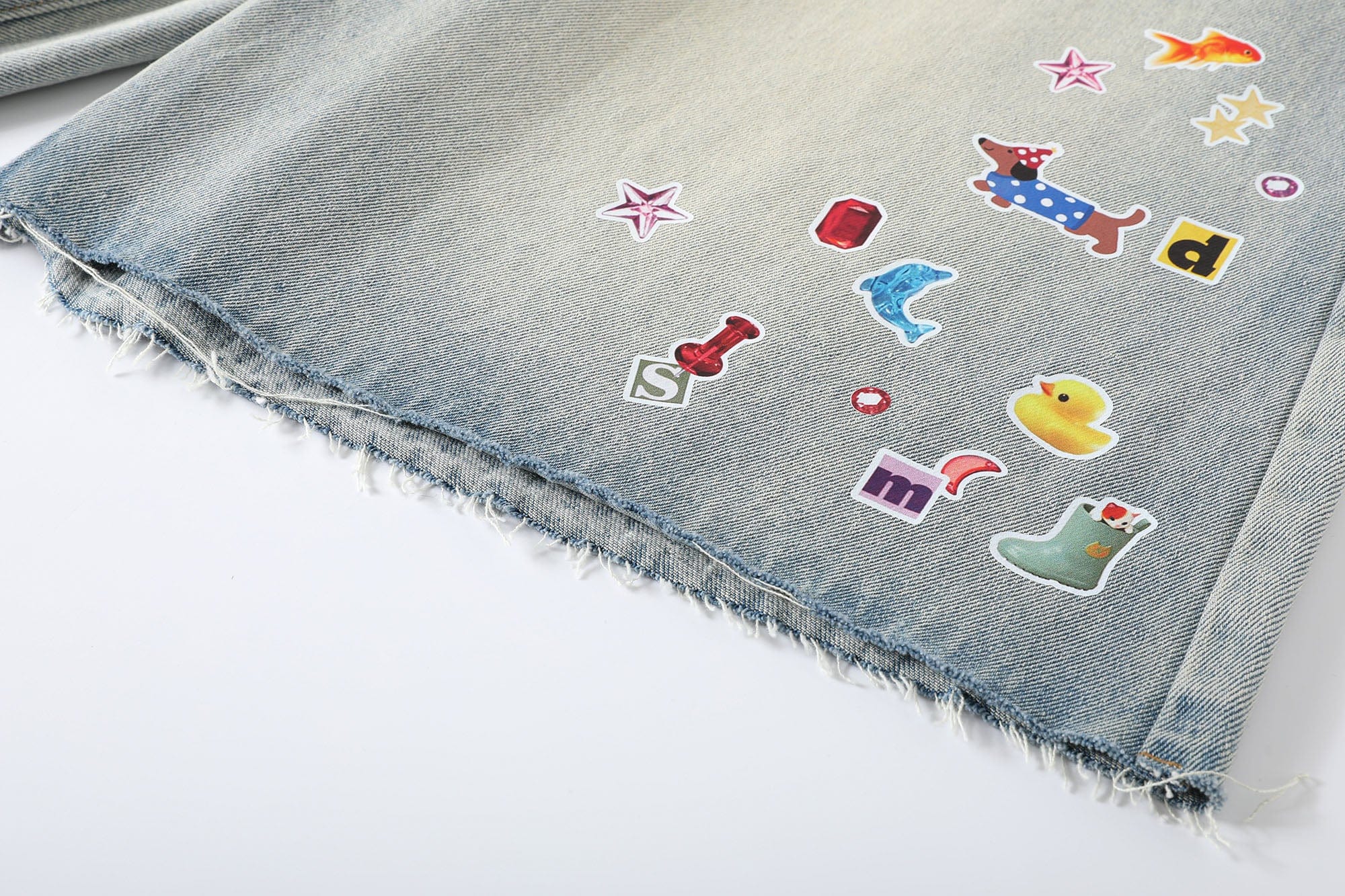 DONSMOKE Whimsical Stickers Washed Raw-Edge Shorts