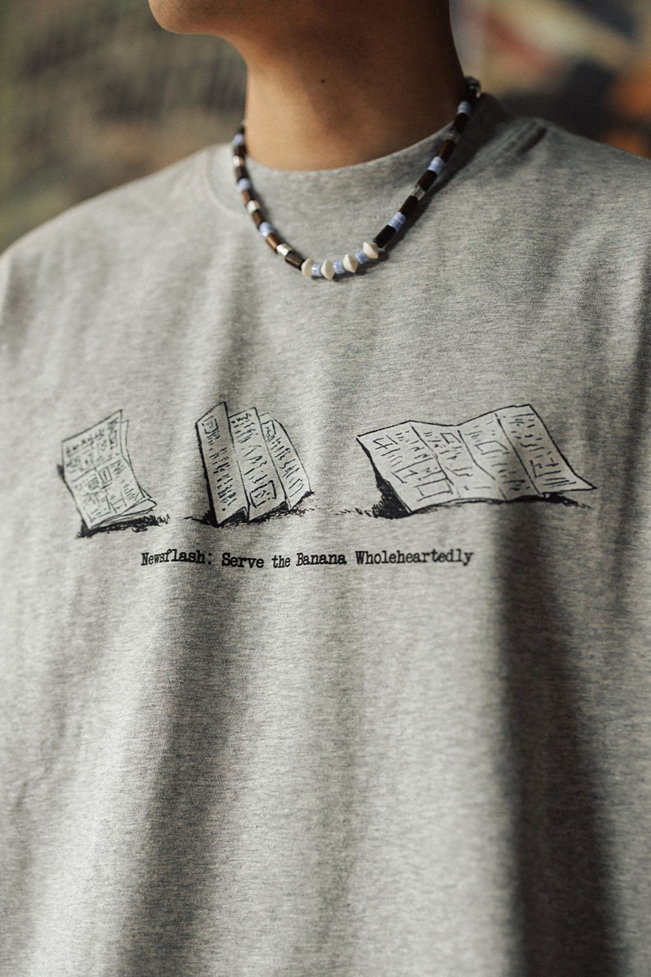 BANANA CLUB Newspaper Graphic Sorona Oversized T-Shirt