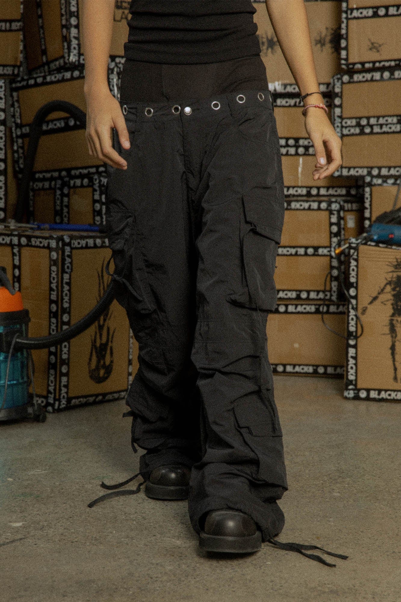 BLACK8MOB Eyelet Waist Tie Multi-Pocket Parachute Pants