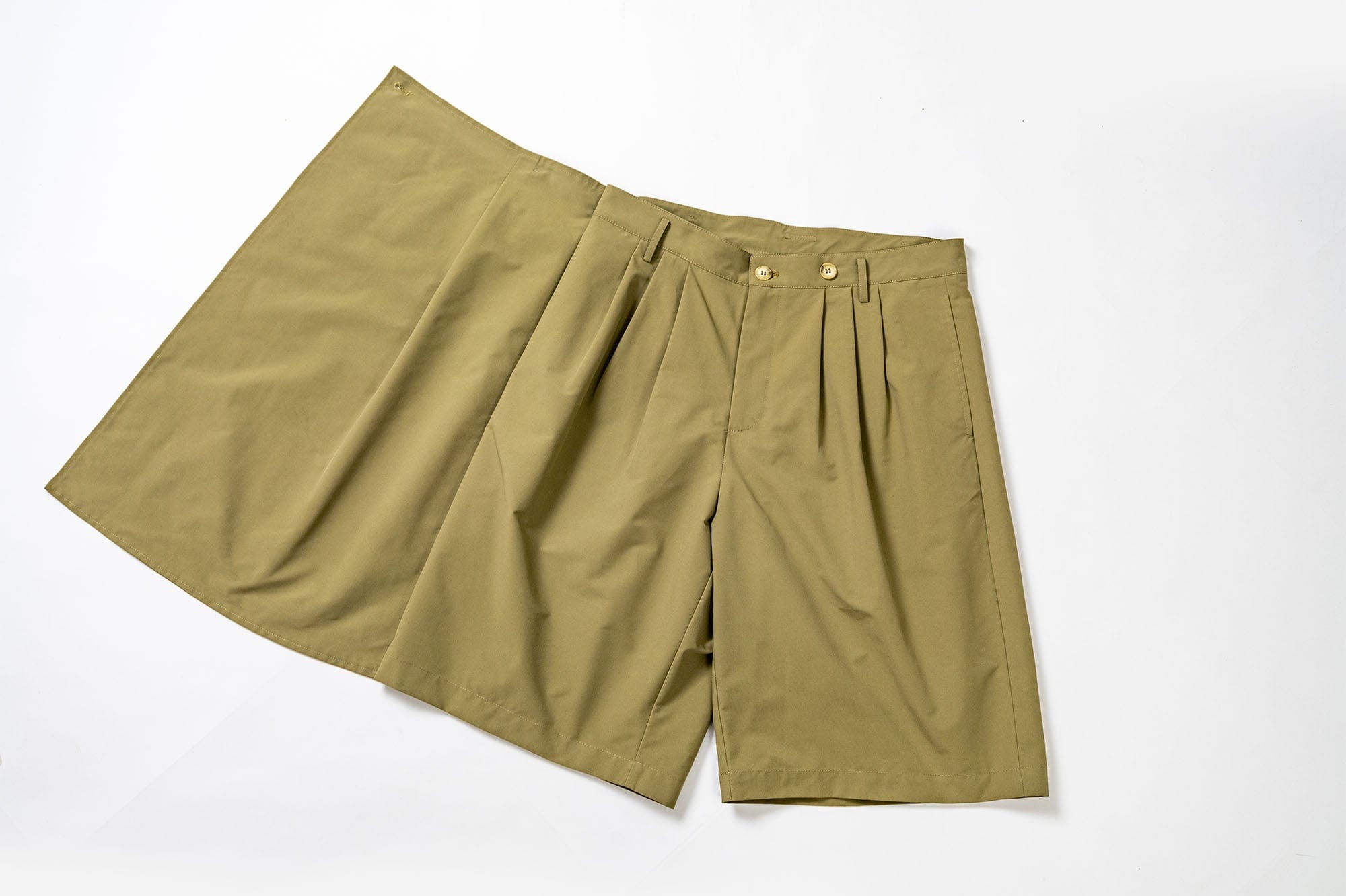 KADAKADA Asymmetrical Overlay Pleated Shorts