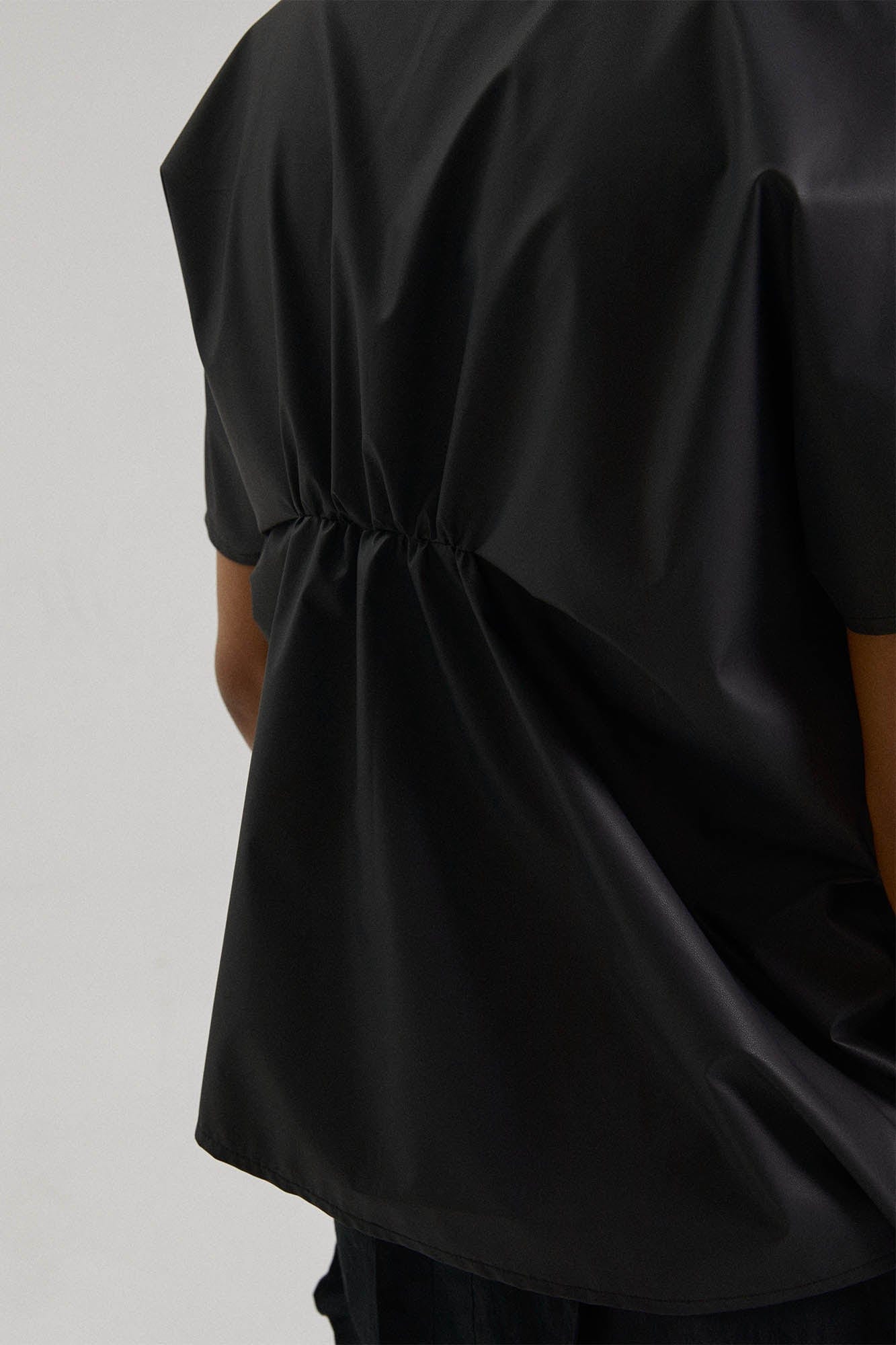 KADAKADA Asymmetrical Pleated Faux Leather Half Shirt
