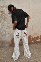 TRIANGLE PROJECT Distressed Crescent Blade Flared Denim Pants