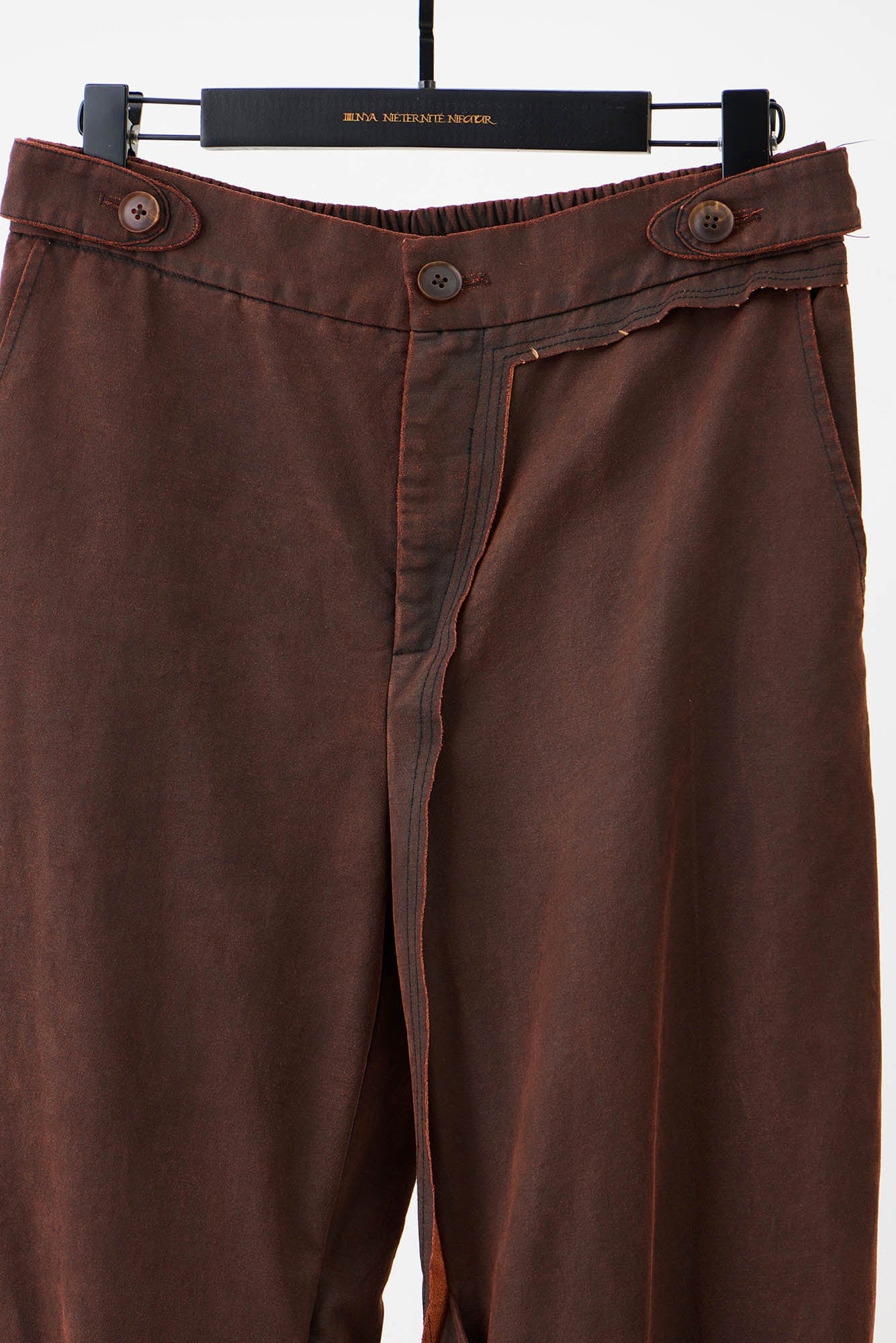 ILNya Nieternite Nifutur Weathered Coated Deconstructed Trousers